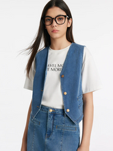 a lady in a single-breasted denim vest with a white T-shirt